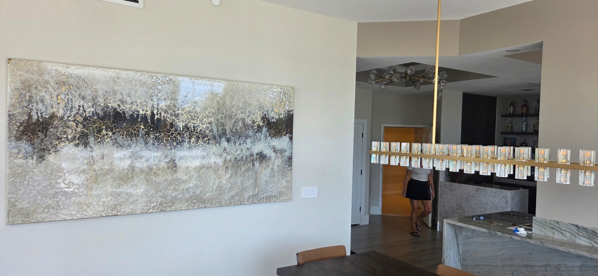 Large textured artwork installed in a residential dining space
